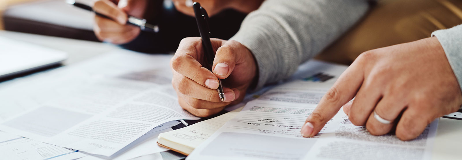 Two people working on documents.