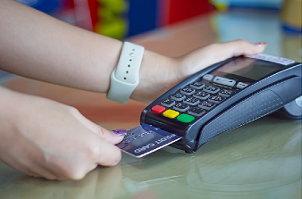 Woman using card in credit card reader